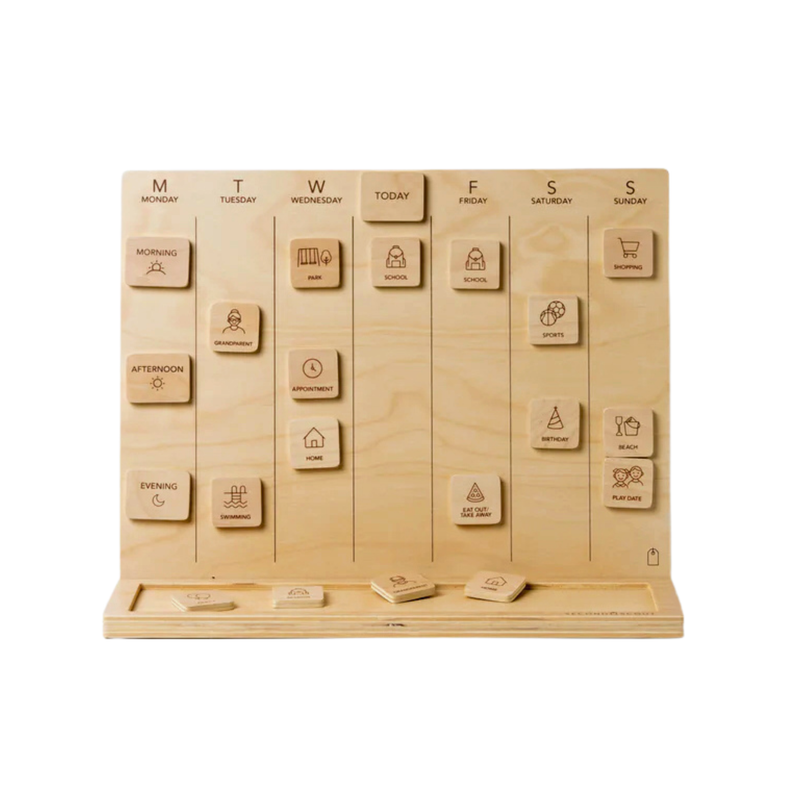 Wooden large visual schedule board with movable tiles showing days, times of day, and simple activity icons arranged on a stand.